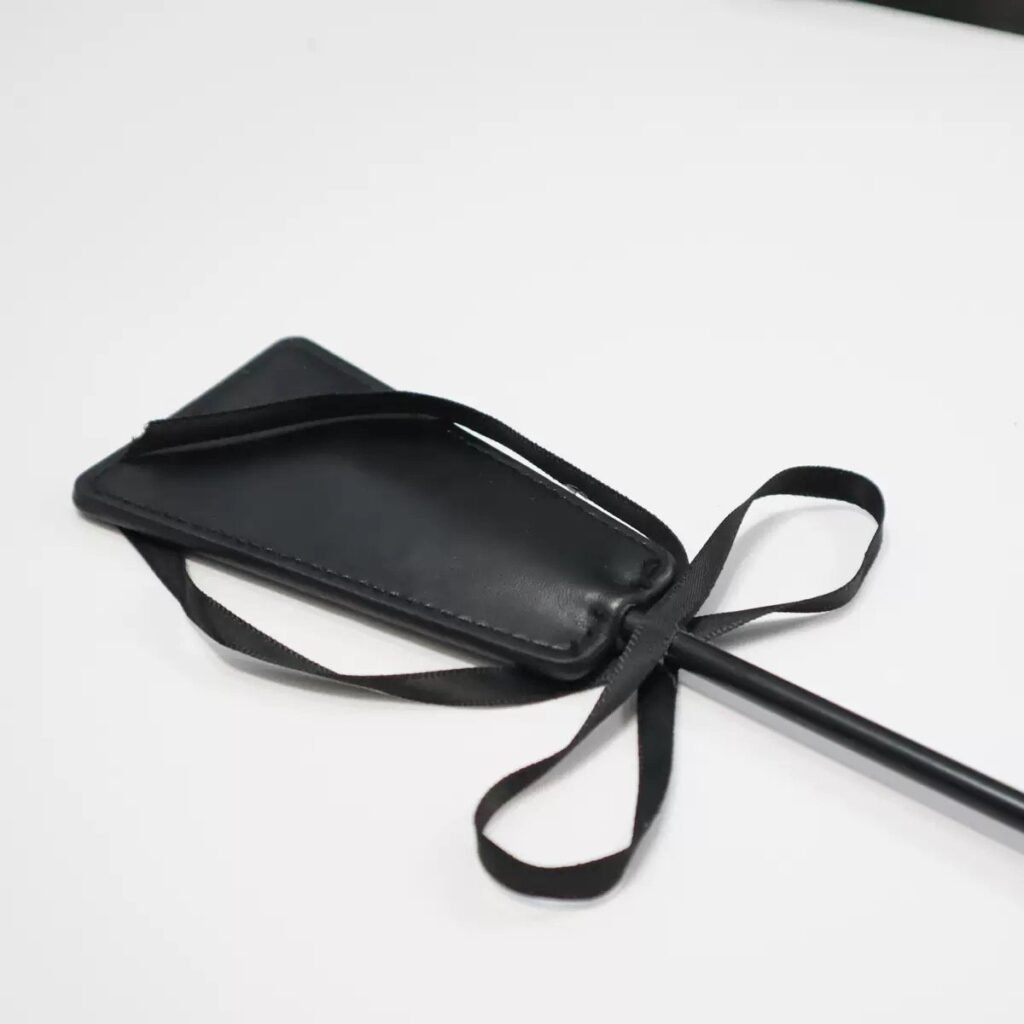 Feather Crop — Noir Rouge. Handmade full-grain leather paddle. UK bondage accessories for couples.
